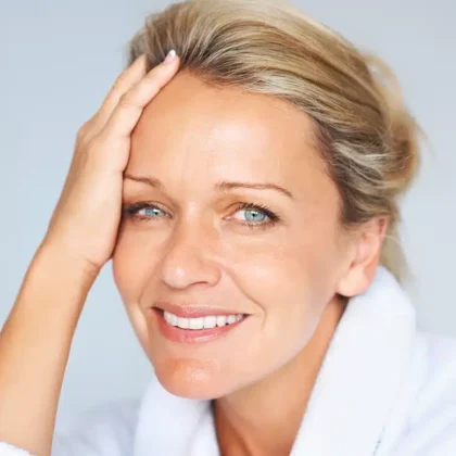 middle aged woman with clear skin smiling