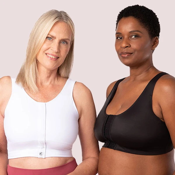 a blond white woman wearing a white bra and a black woman wearing a black bra.