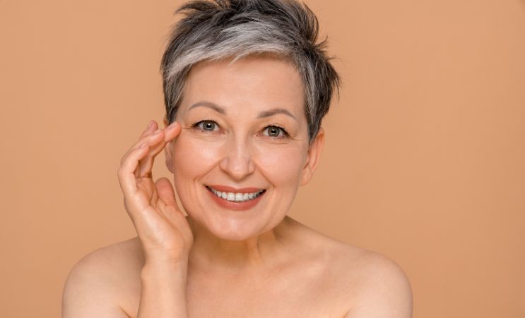 woman showing signs of aging skin
